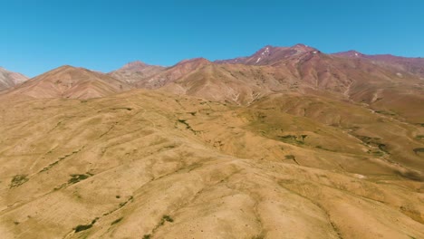 diverse landscape of fergana valley in namangan region, uzbekistan under clear blue sky
