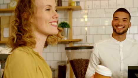 waiter serving coffee to customer 4k