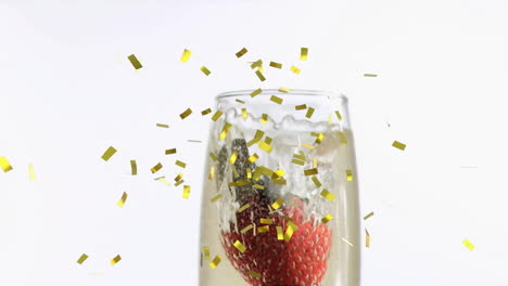 Animation-of-confetti-falling-over-champagne-glass