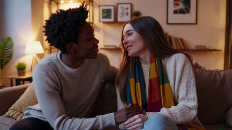 affectionate couple sharing a tender moment on a sofa