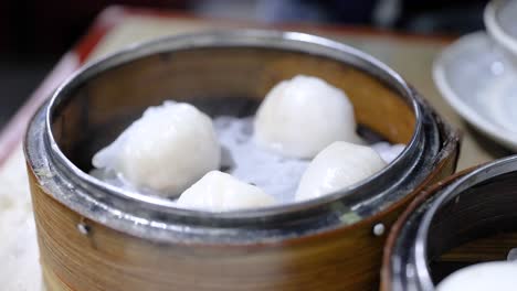 steamed dumplings in a bamboo steamer