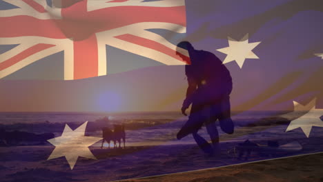 animation of flag of australia over caucasian man with dogs at beach