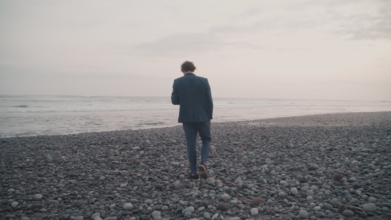 Business Man On Pebble Beach