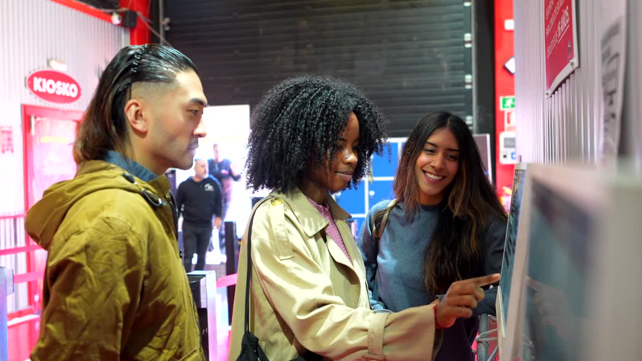 Diverse Group of Young Friends Interacting with a Digital Kiosk Screen
