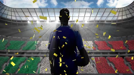 Golden-confetti-falling-over-rear-view-of-male-rugby-player-against-sports-stadium