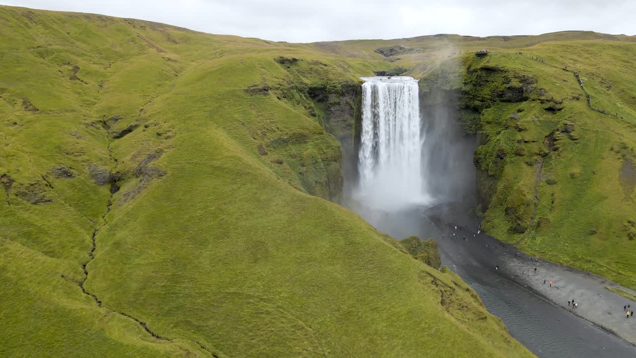 Experience Sk&oacute;gafoss Waterfall from above with our 4K drone footage, highlighting Iceland's epic scenery