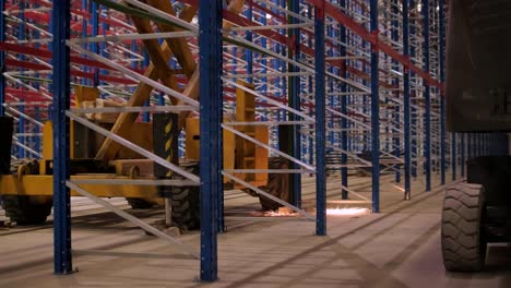 big and modern warehouse under construction, featuring metal shelving and other industrial equipment.