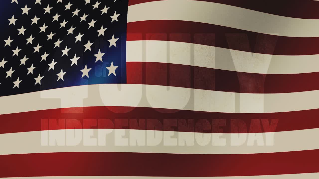 Festive fireworks in the form of the text - 4 th of july Independence Day - against the background of a waving USA flag. 4k video of high quality 16x9.