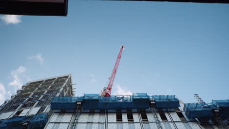 red crane at construction site city centre sheffield, south yorkshire