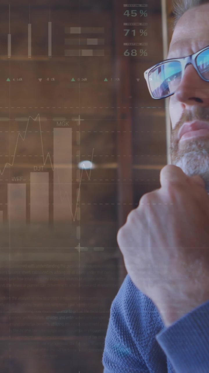 Animation of statistical data processing against thoughtful caucasian man using laptop at home