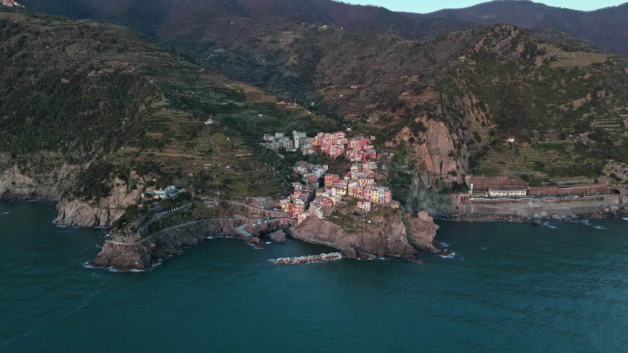 Picturesque aerial view of Manarola, Cinque Terre, showcasing the colorful village on the cliffs