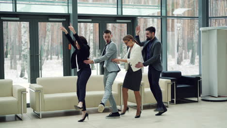 business team celebrating in modern office