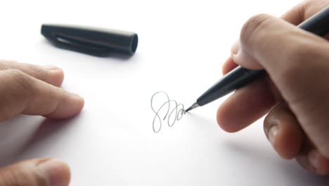 person signing a document