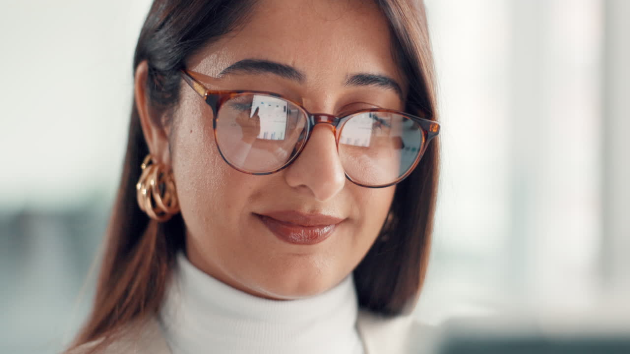 Portrait of a Smiling Woman Wearing Glasses