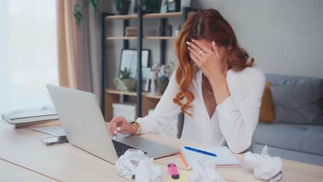 young tired woman experiences stress and professional burnout working in office