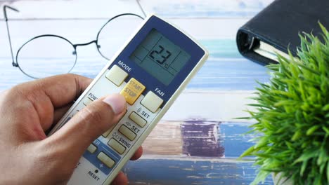 adjusting temperature with an air conditioner remote