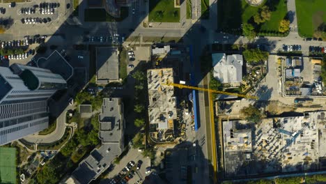 aerial view of a city with construction site and high-rise buildings