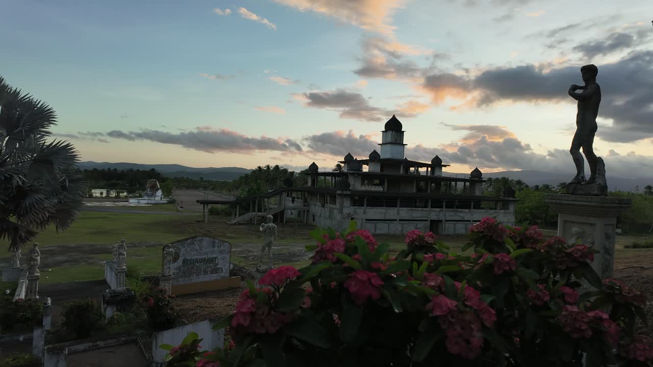 Time lapse at sunset with water and statue, calming yet dramatic scene