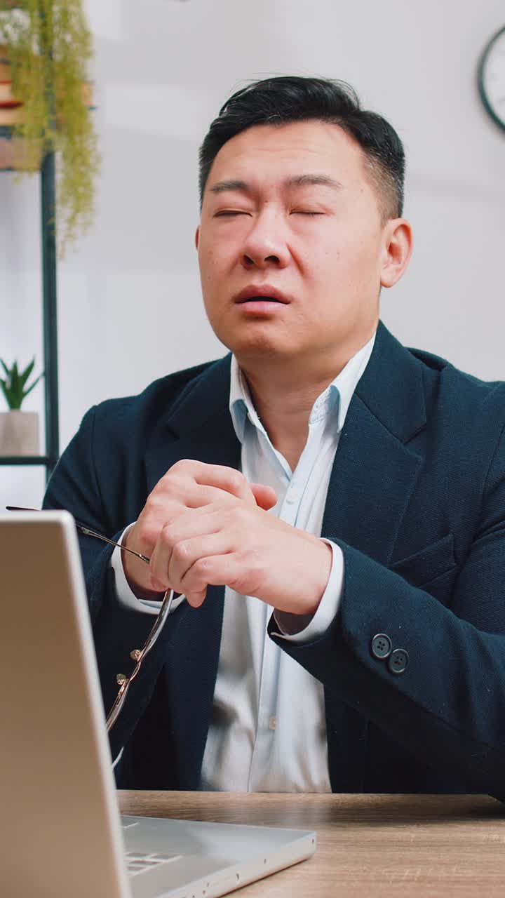 Asian businessman worried about financial problem stress money debt budget loss bankruptcy