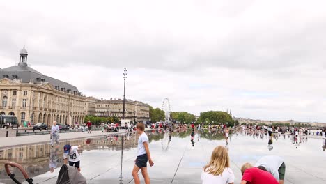 people gather at bordeaux's iconic water mirror