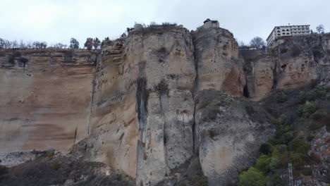 impressive tall vertical limestone cliffs below spanish town, ronda