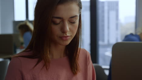 Businesswoman-working-with-documents-at-workplace.-Professional-typing-on-laptop