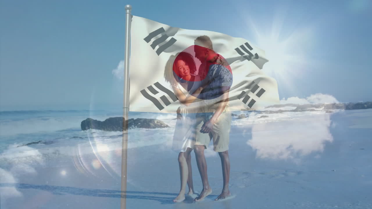 Walking on beach, couple holding South Korean flag in bright sunlight animation