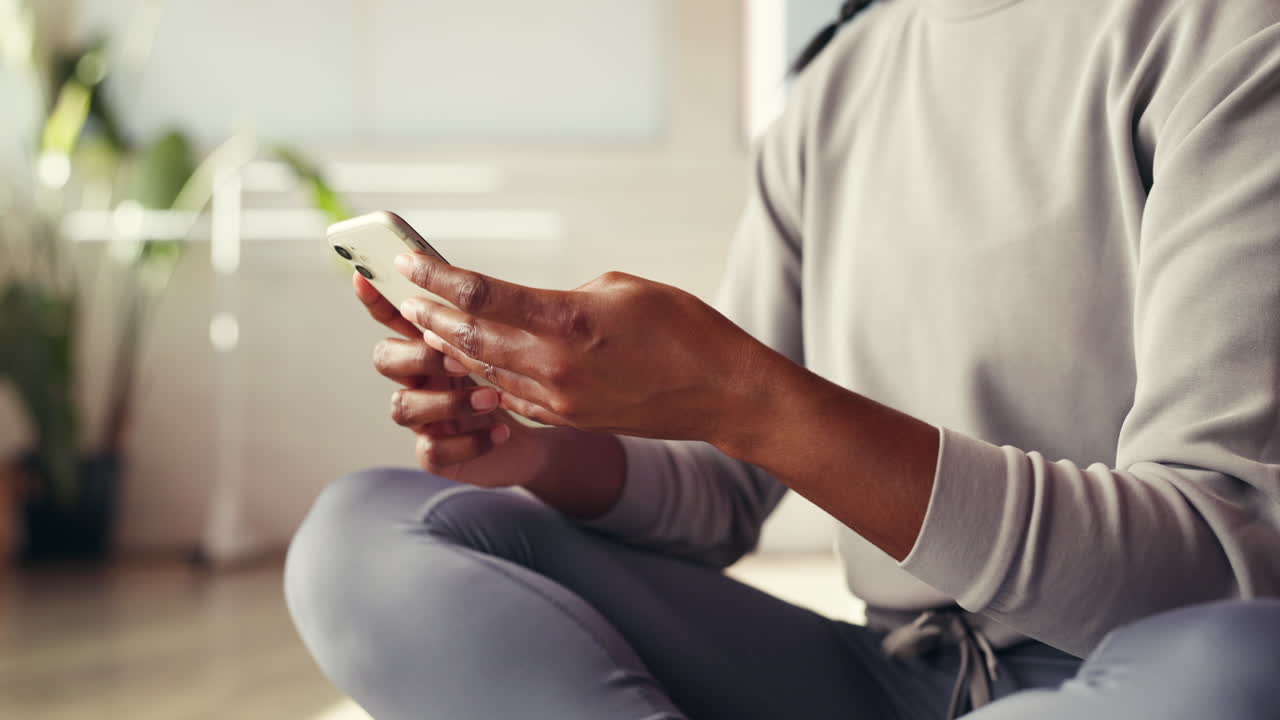 Woman using smartphone at home