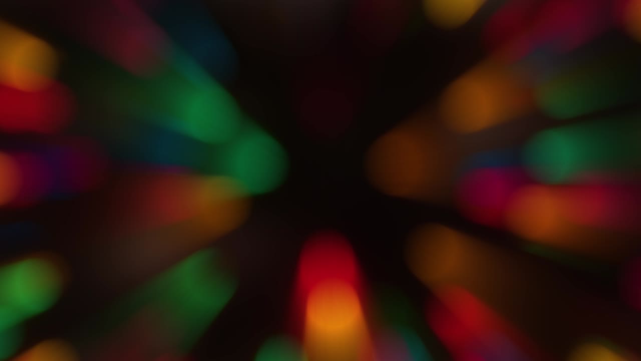 Rotating bokeh background lights with a radial blur. Concept: Christmas, New Years