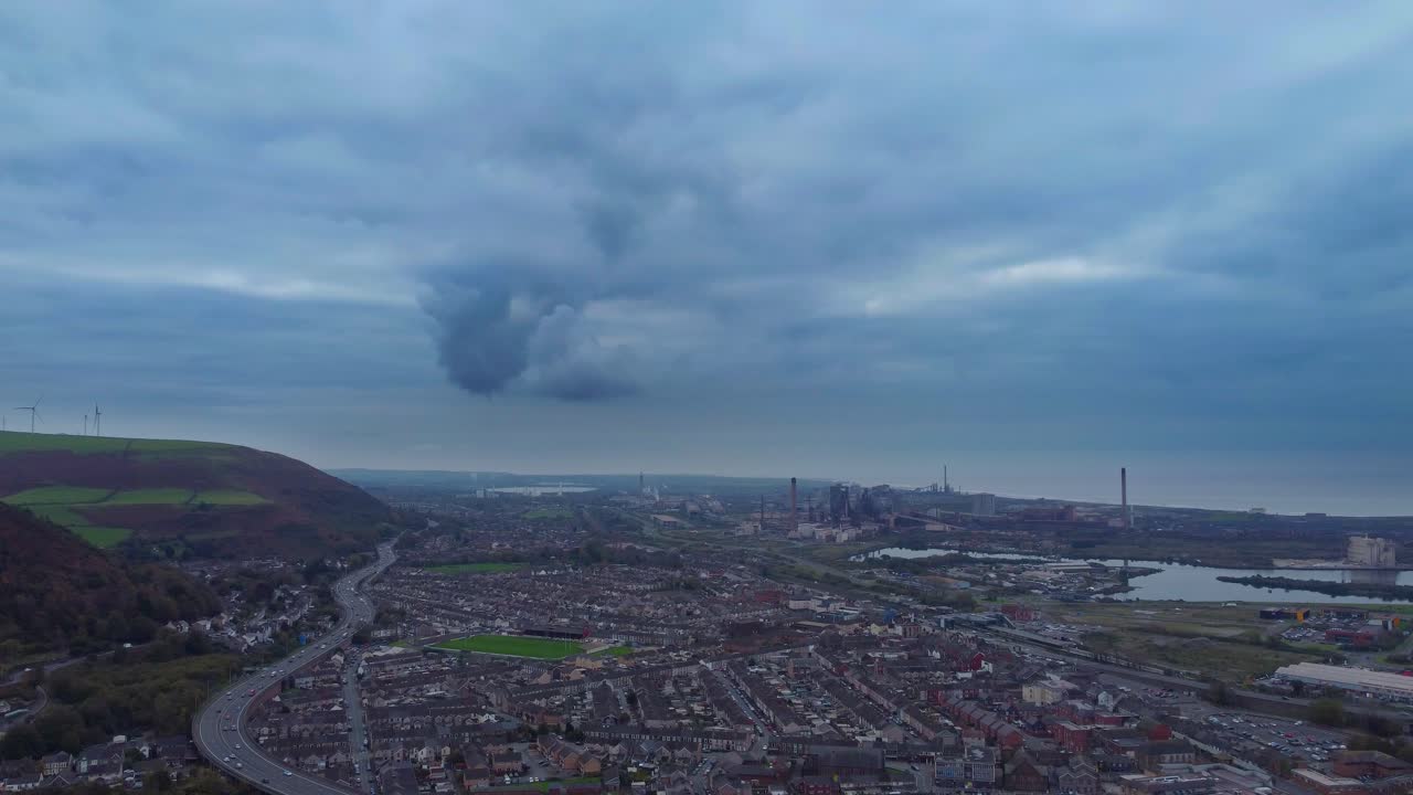 Aerial View of Industrial Landscape with Smoke Pollution