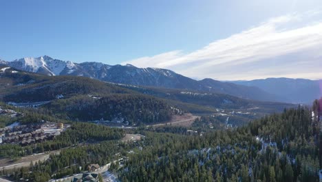 drone footage captures a ski mountain with snow-covered trails, quiet forests, and majestic views, creating a perfect visual of winter adventure and alpine calm