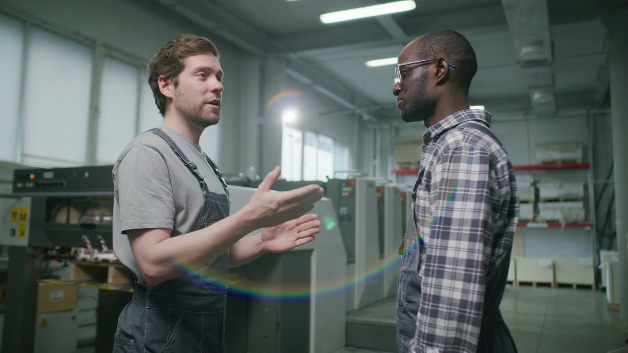 Diverse Industrial Workers Shaking Hands and Speaking in Printing Factory