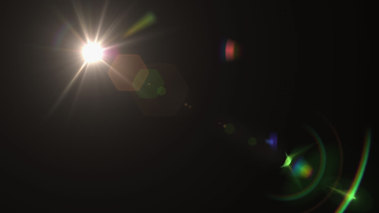 animación digital de manchas de luz coloridas y destello de la lente moviéndose contra un fondo negro