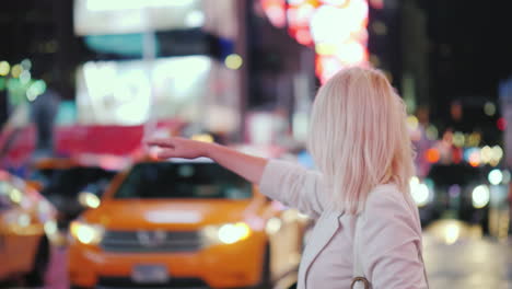 woman stops famous yellow cab in times square