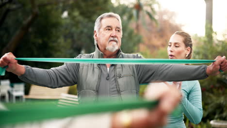 Senior man exercising with resistance band