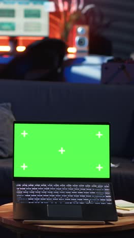 vertical video young male person enjoys leisure time next to chroma key on bean bag