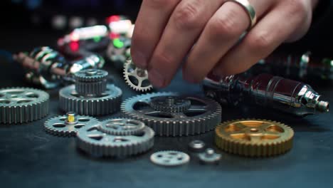 intricate mechanics: a close-up exploration of precision gears and metal components in action as artisans assemble a complex mechanical structure
