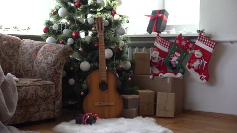 Flat-lay-composition-with-guitar-and-Santa-hat,-space-for-text.-Christmas-music