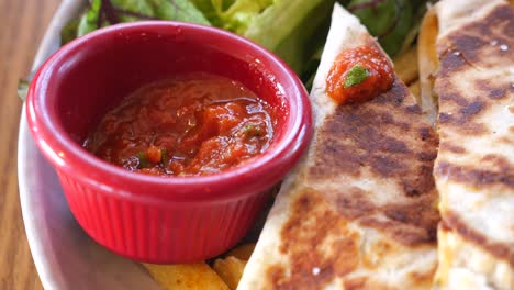 quesadilla with salsa and salad