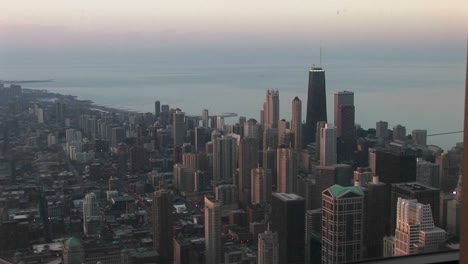 an bird's eye view of chicago's downtown skyline and lakefront during the goldenhour