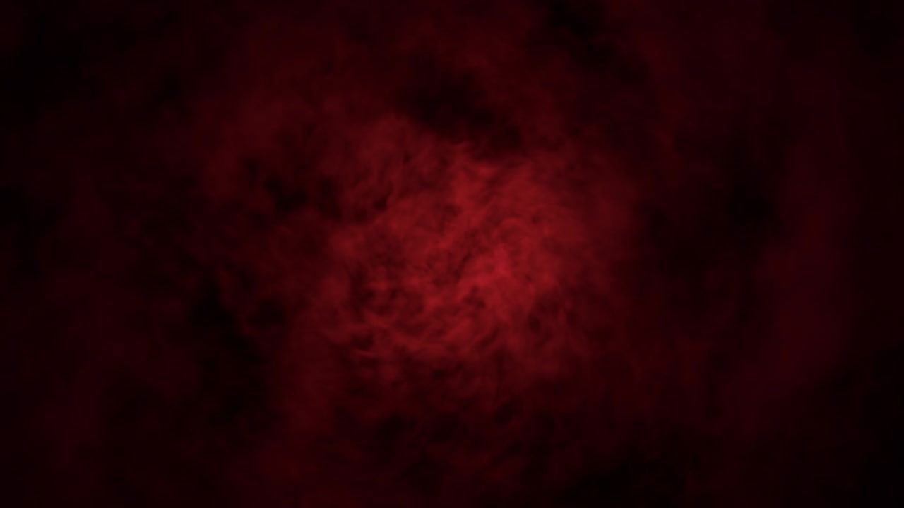 색이 인 연기가 카메라를 향해 불고 있습니다.