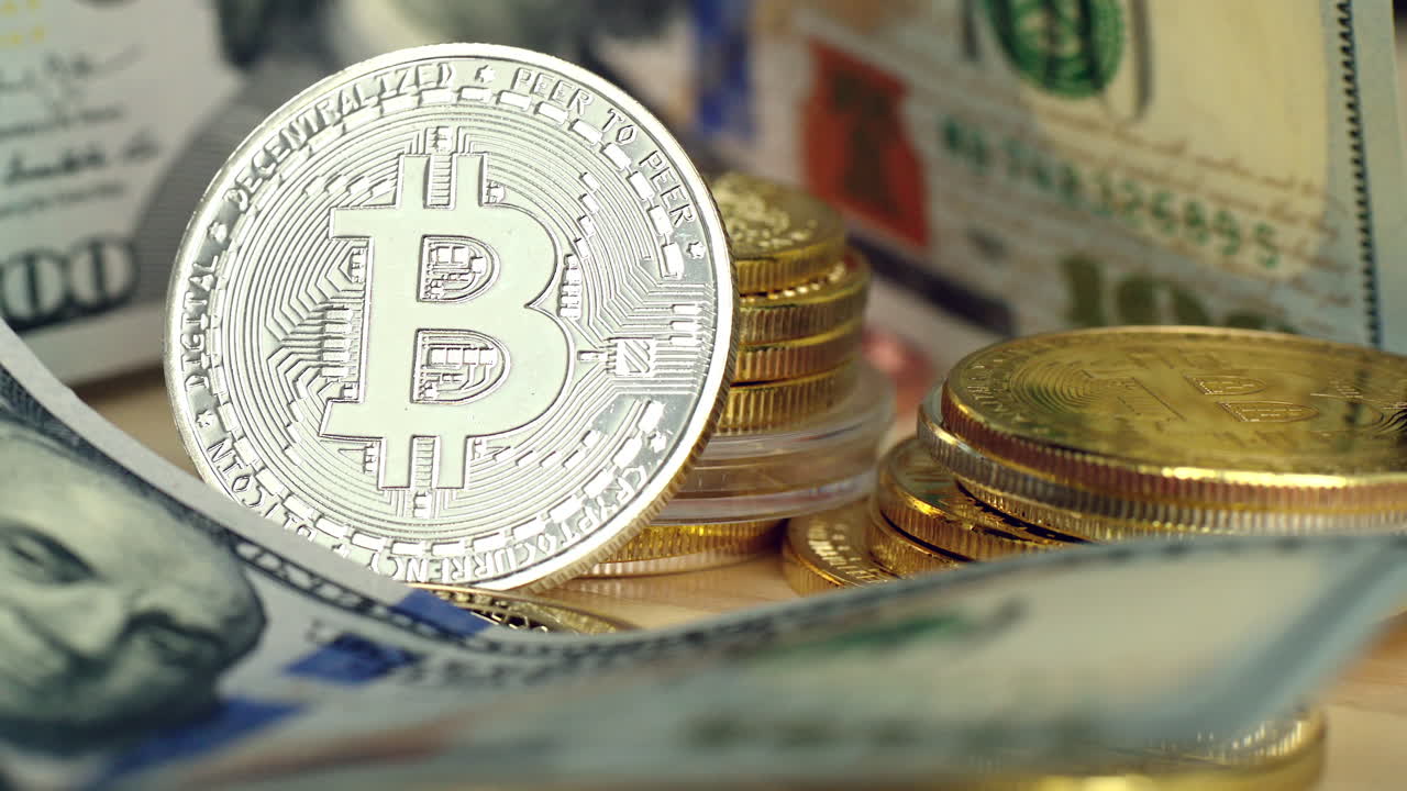 Close up crypto coins with silver bitcoin and dollars