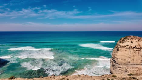 the iconic 12 apostles of the great ocean road of melbourne, australia. the footage pans to reveal the scenic view of the waves.