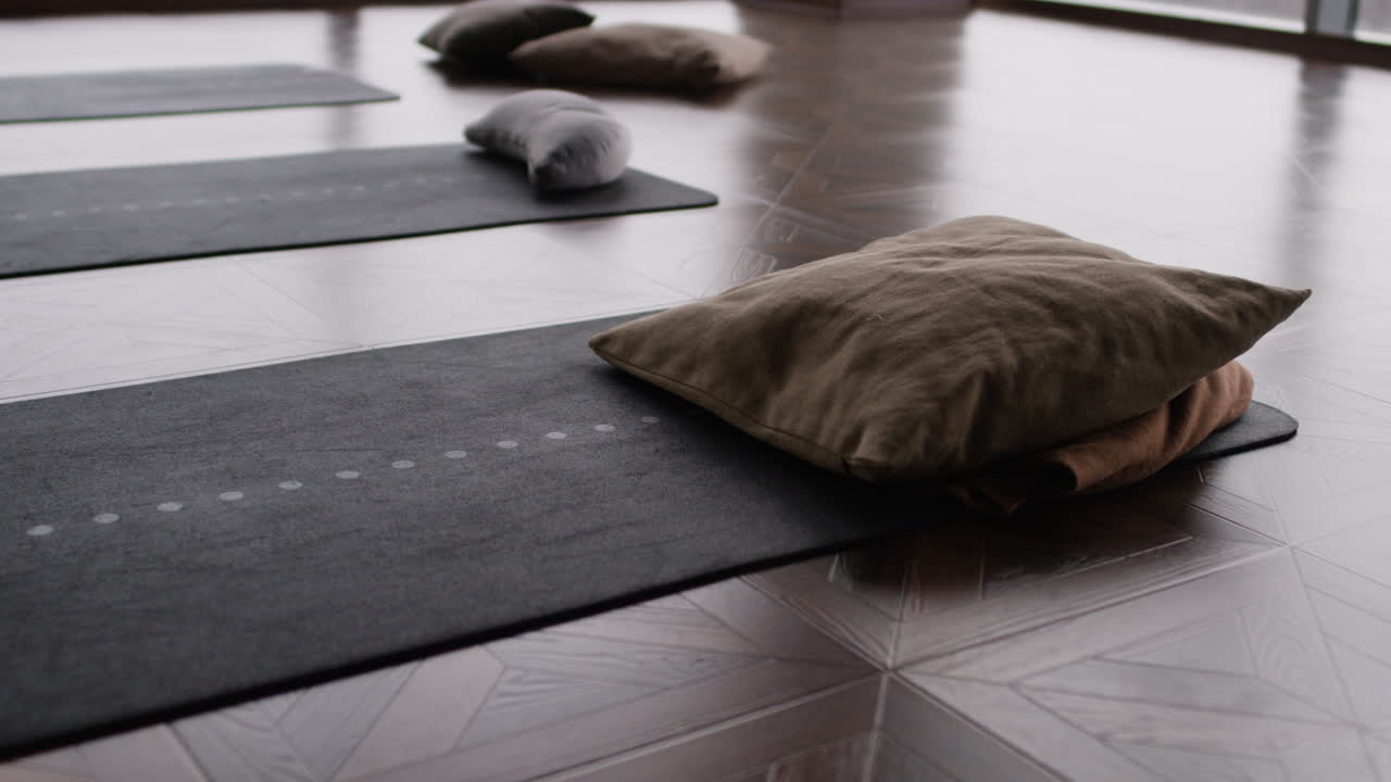 Yoga mats and cushions in a studio