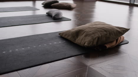 yoga mats and cushions in a studio
