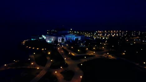 aerial of vast illuminated urban park at night