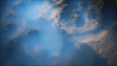 distant mountain range and thin layer of fog on the valleys