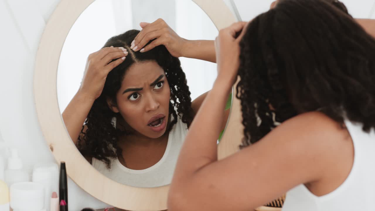 Woman Checking for Hair Loss
