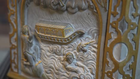the biblical flood and noah's ark depicted on a stone romania carving
