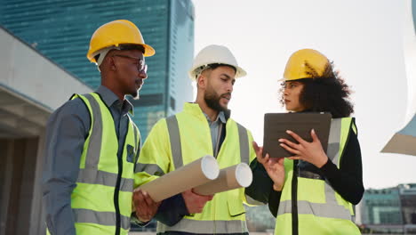 People,-architect-and-team-with-tablet-in-city